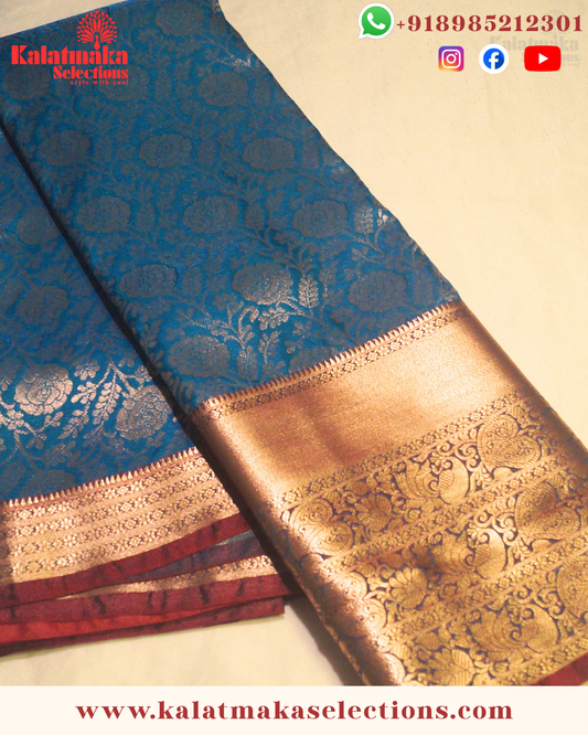 Sea Blue Color Kancipattu saree with all over golden zari and cooper border with blouse