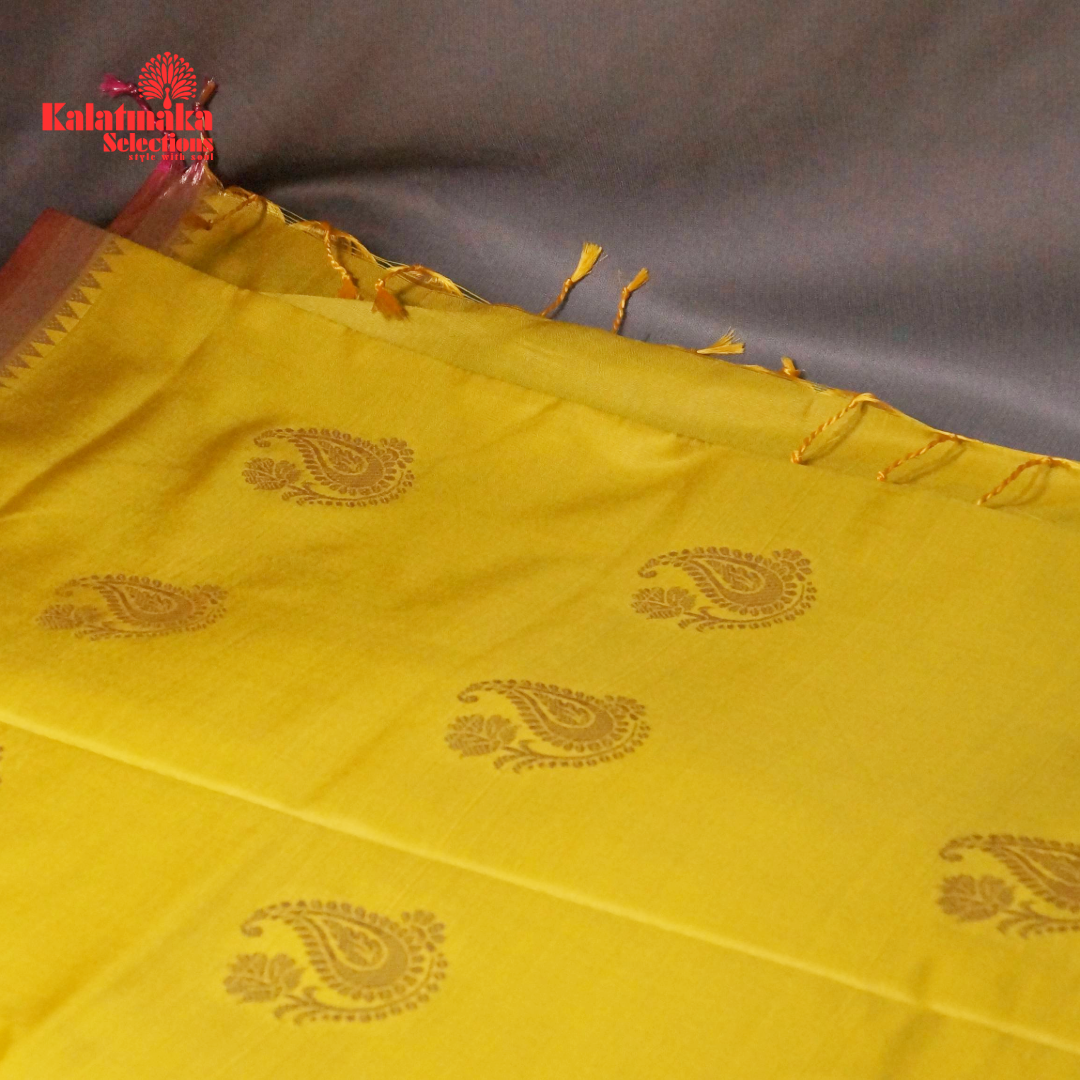 Yellow Uppada Soft Pattu Saree with all over Boota Design and Pink Border with Tussels