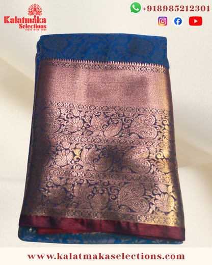 Sea Blue Color Kancipattu saree with all over golden zari and cooper border with blouse