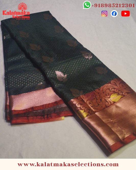 Dark Green Pattu Saree with contrast border with copper butta and copper border with blouse