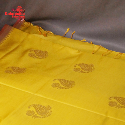 Yellow Uppada Soft Pattu Saree with all over Boota Design and Pink Border with Tussels